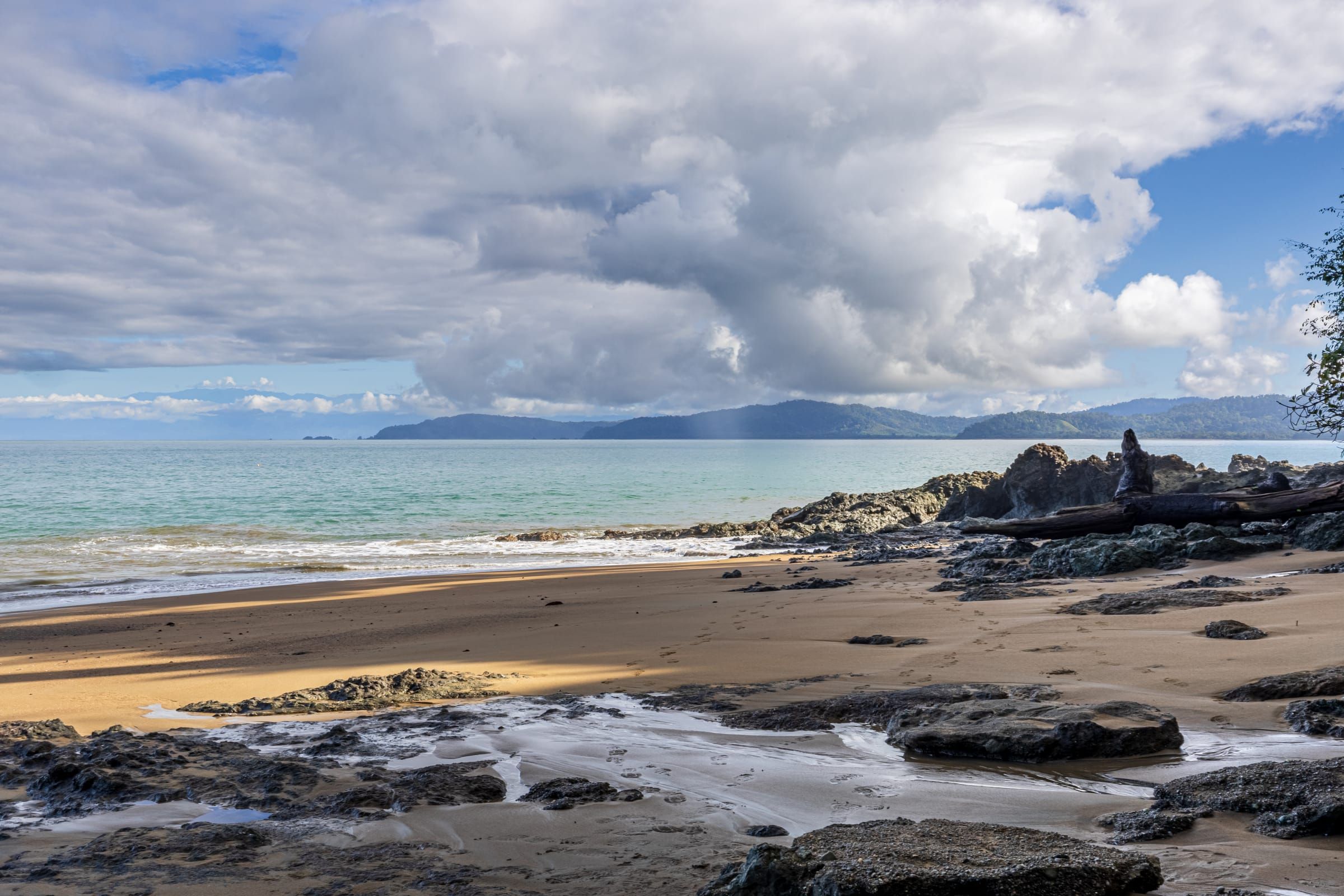 Rocky beach below the lodge on a sunny day