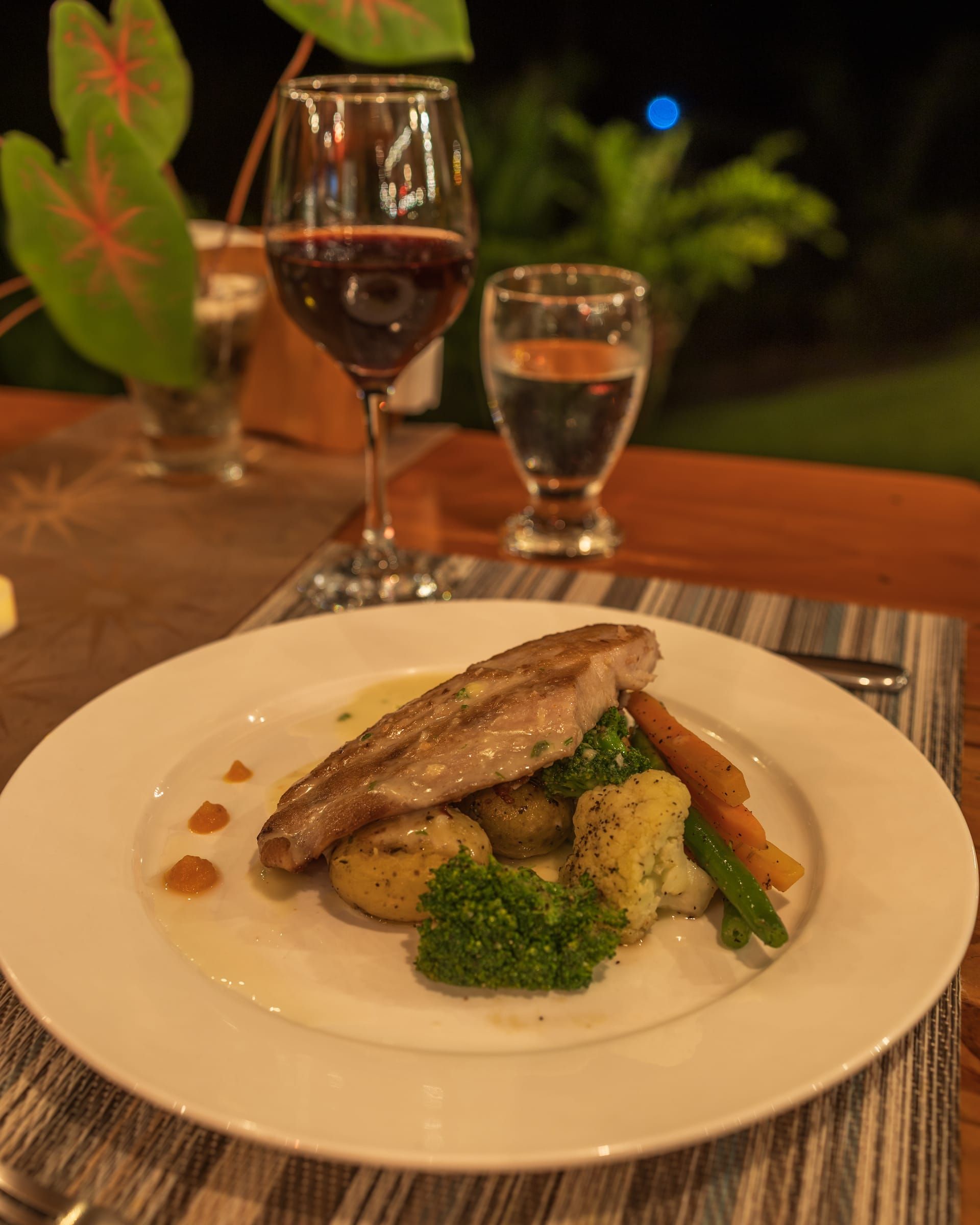 Grilled fish with vegetables and potatoes at dinner