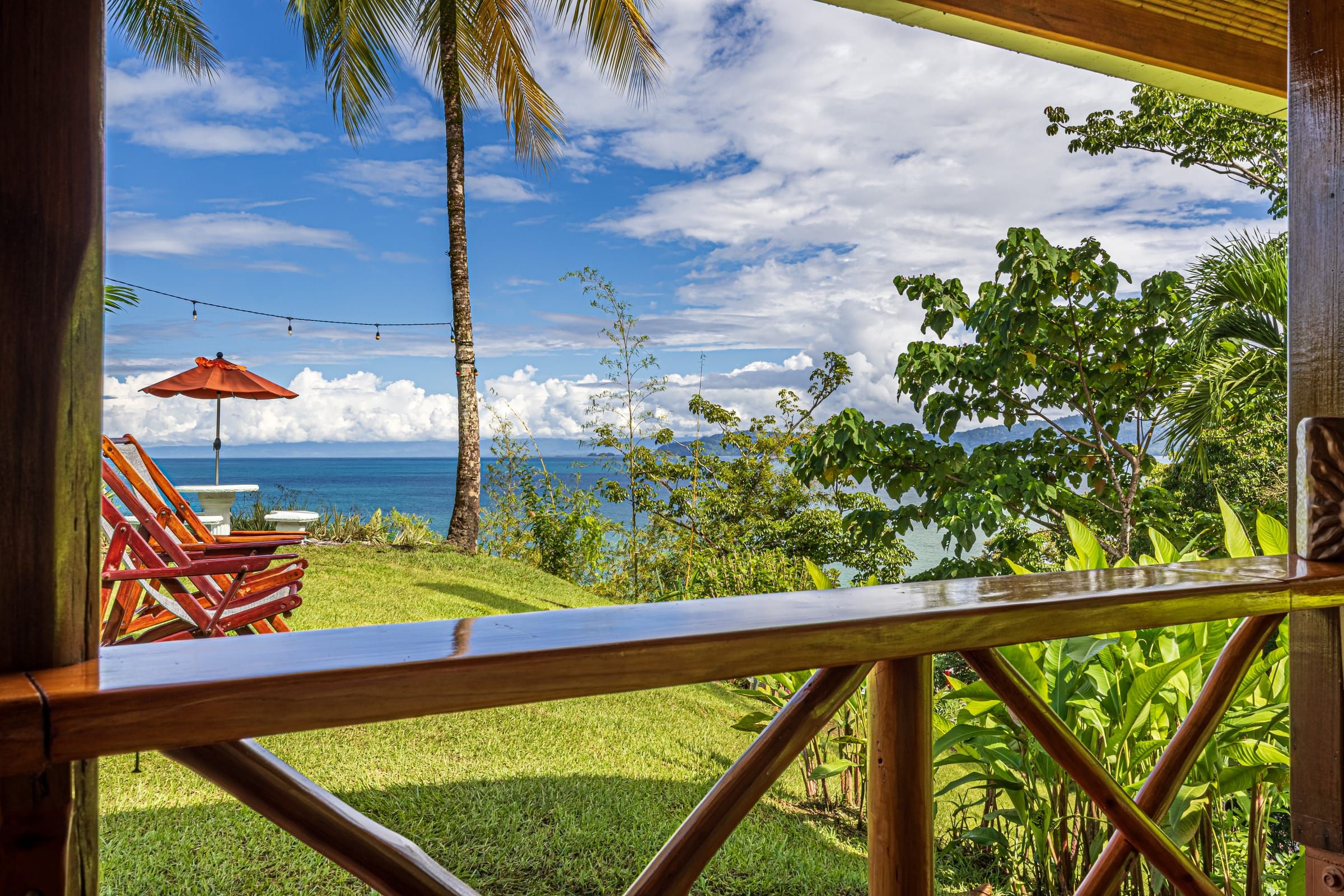 View from a porch across the lawn to the ocean
