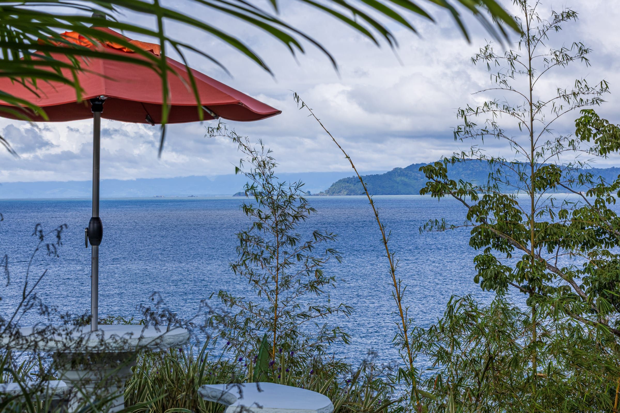 A red umbrella at the lookout above the bay